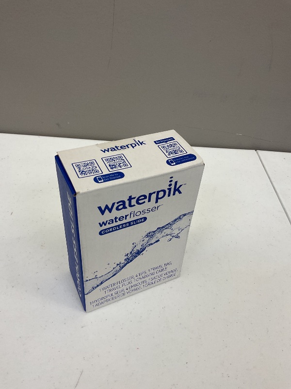 Photo 1 of Waterpik Cordless Slide Professional Water Flosser, Portable Collapsible for Travel and Storage, with Travel Bag and 4 Tips, ADA Accepted, Rechargeable and Waterproof, White WF-17CD010-1