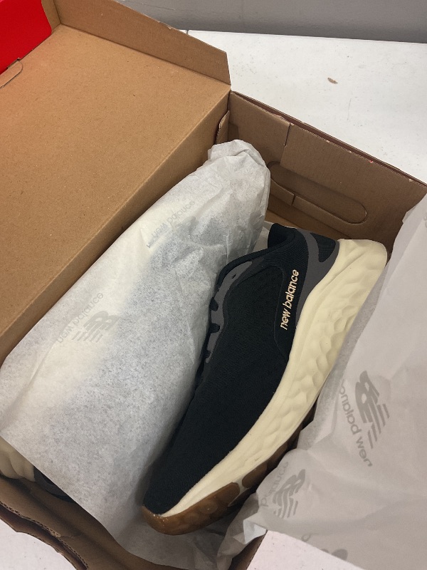 Photo 1 of New Balance Women's Fresh Foam Arishi V4 Running Shoe, Black/Light Gold Metallic/Gum 2, 6.5 Wide