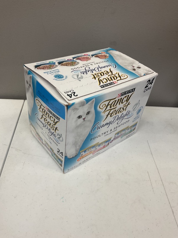Photo 1 of Exp date 04/2027.    Purina Fancy Feast Wet Cat Food Variety Pack, Creamy Delights Poultry & Seafood Collection - (Pack of 24) 3 oz. Cans