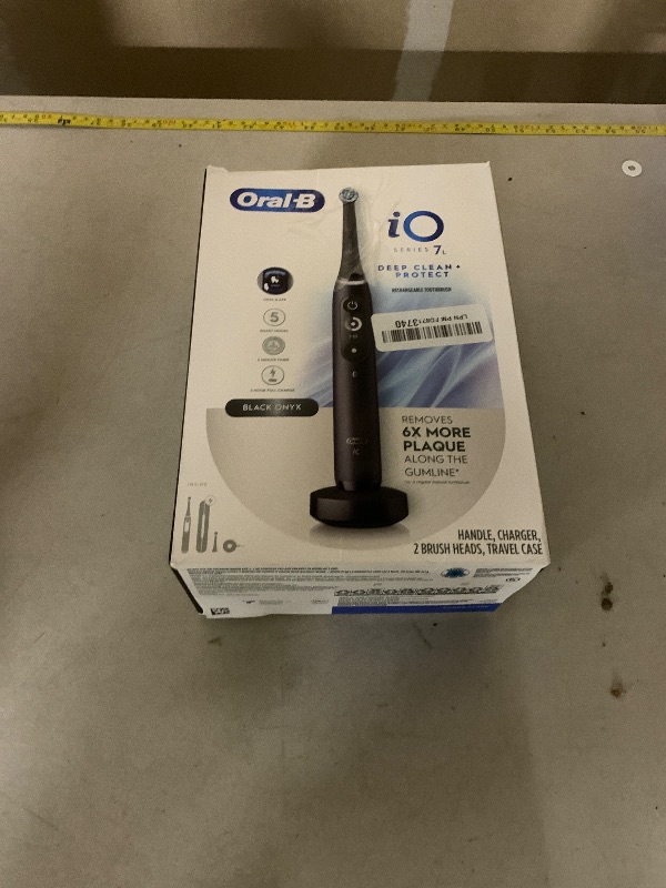 Photo 1 of *SEE NOTES** Oral-B iO Deep Clean + Protect Rechargeable Electric Toothbrush, Black with a iO Series 7 Toothbrush, 2 Replacement Brush Heads, and a Charging Travel Case