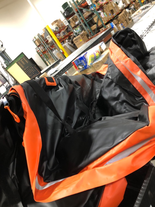 Photo 1 of BIG PLASTIC BLACK AND ORANGE BAG