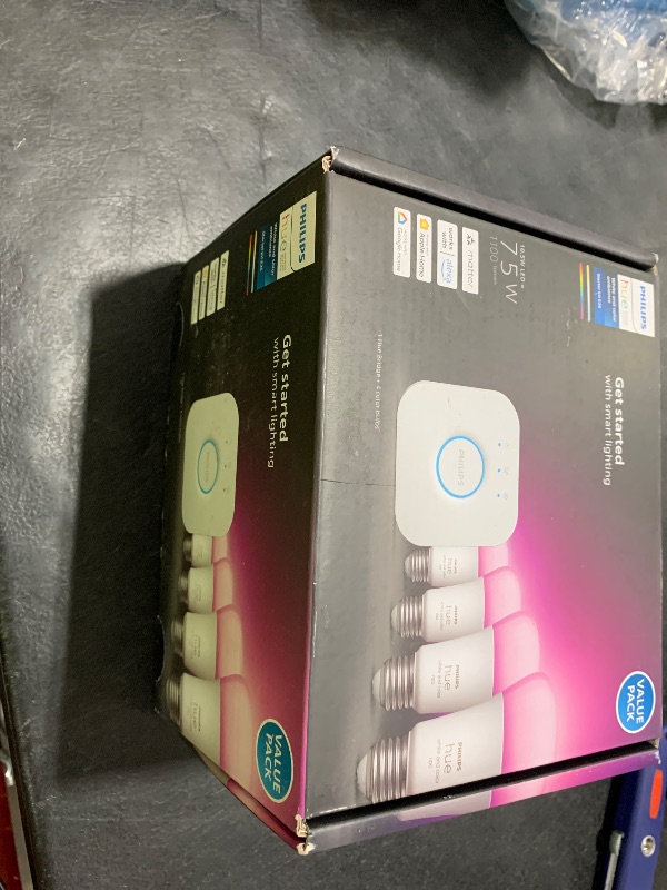 Photo 1 of Philips Hue Smart Light Starter Kit - Includes (1) Bridge and (4) 75W A19 E26 LED Smart White and Color Ambiance Bulbs - Control with App - Compatible with Alexa, Google Assistant, and Apple HomeKit