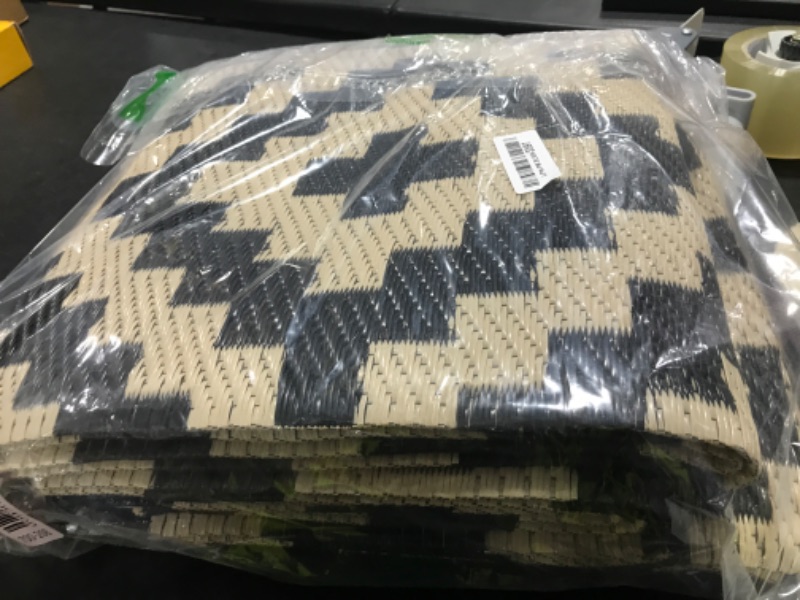 Photo 1 of Smiry Waterproof Outdoor Rug 5x8 ft, Reversible Plastic Straw Patio Camping Rugs, Outdoor Indoor RV Mat Carpet for Patio, Outside Entry, Backyard, Deck, Bench, Picnic, Camper, Black & Beige