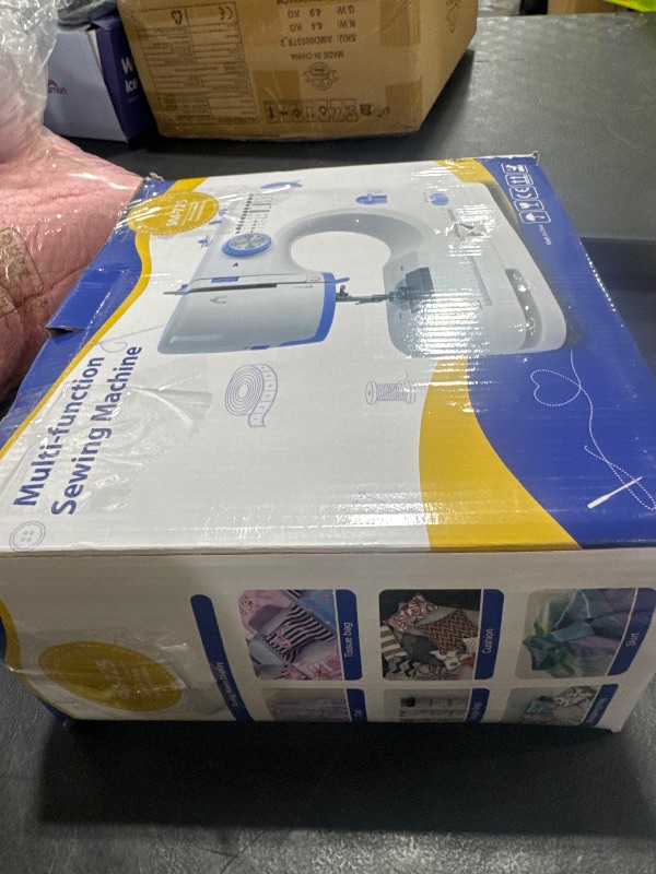 Photo 1 of Stoigeld Sewing Machine for Beginners with 20 Pcs Fabric and 32 Pcs Sewing Threads Kit,Portable Sewing Machine with 12 Built-in Stitches,2 Speed(High-Low Speeds) - White Blue