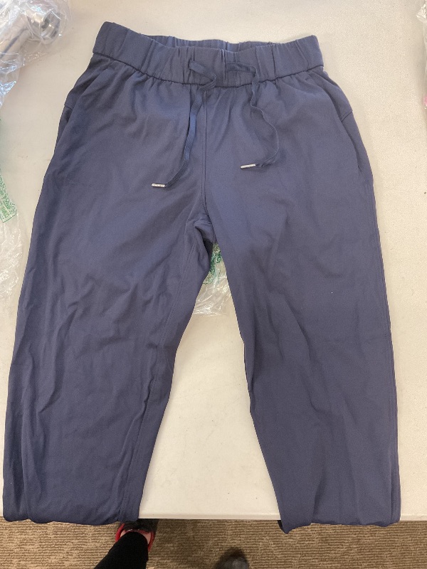 Photo 1 of Dark navy blue stretchy pants  with waist tie and pockets  size XS 
