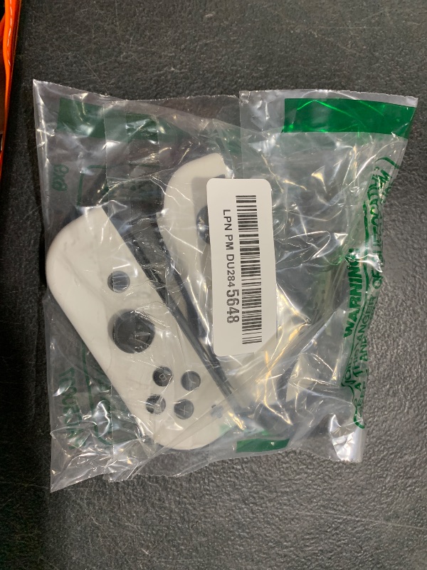 Photo 1 of Nintendo Switch OLED White Joy-Cons (L/R) Pair (Renewed)