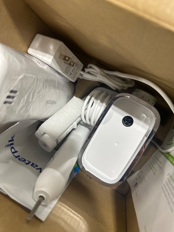 Photo 1 of Waterpik Sensonic Complete Care Water Flosser and Rechargeable Electric Toothbrush Combo Set for Teeth Cleaning and Flossing, CC-04, White, Packaging May Vary