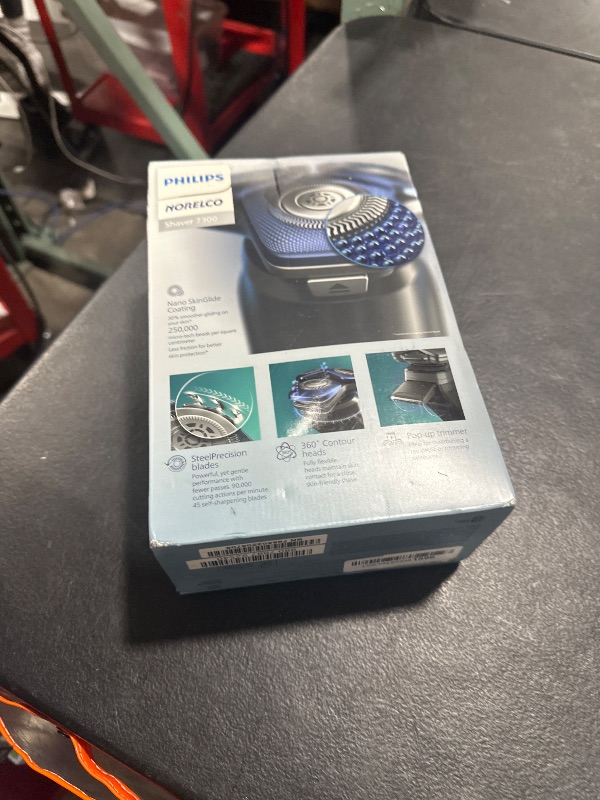Photo 1 of Philips Norelco Shaver 7300, Rechargeable Wet & Dry Electric Shaver with SenseIQ Technology, Pop-up Trimmer, Charging Stand, Click-on Nose Trimmer, & Travel Case, S7887/92