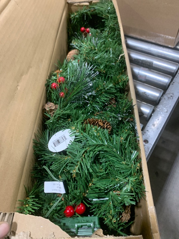 Photo 1 of National Tree Company Pre-Lit Artificial Christmas Garland, Green, Crestwood Spruce, White Lights, Decorated with Glitter, Pinecones, Berry Clusters, Battery Operated, Christmas Collection, 9 Feet