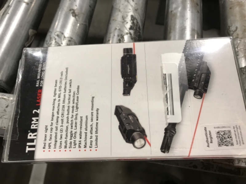 Photo 1 of Streamlight 69448 TLR RM 2 1000-Lumen Rail-Mounted Tactical Weapon Light with Integrated Red Aiming Laser, and Key Kit, Black