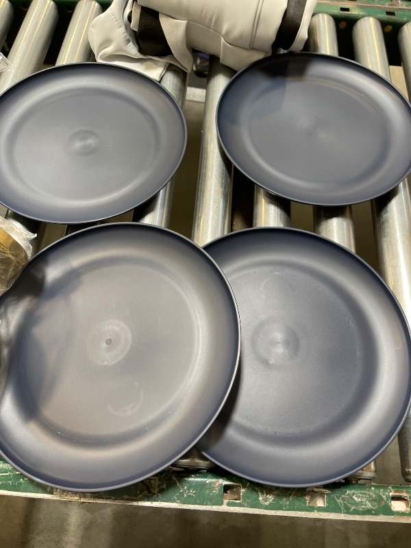 Photo 1 of Four plastic dinner plates