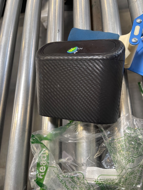 Photo 1 of Accmor Car Trash Can with Lid, Mini Vehicle Trash Bin Portable Car Dustbin Garbage Organizer Holder with One Roll Trash Bag, Small Hanging Leakproof Auto Storage Bag Container (Carbon Fiber)