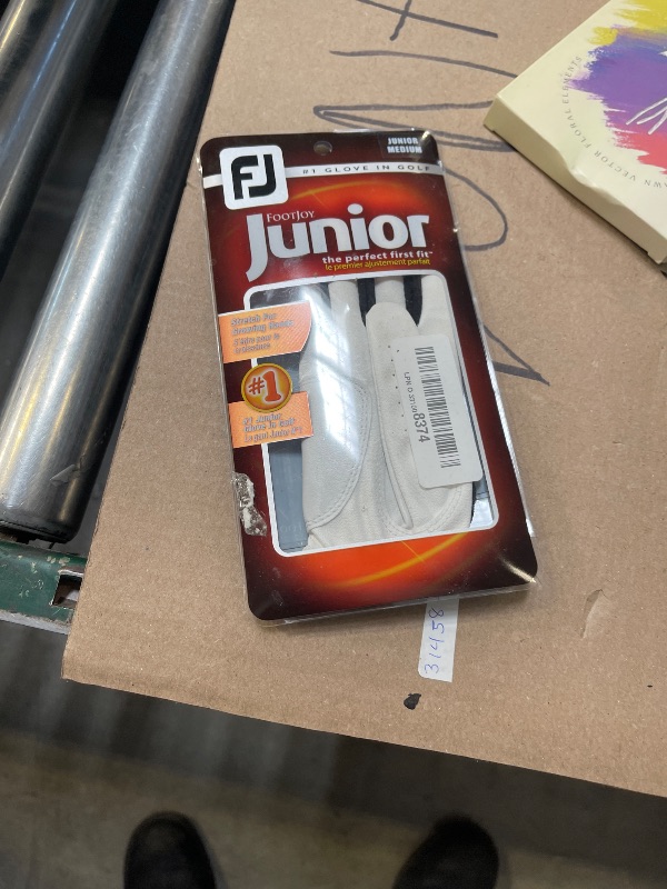 Photo 1 of FootJoy Junior Golf Glove, White Medium, Worn on Left Hand