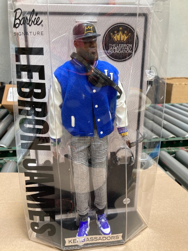 Photo 1 of Barbie Signature Lebron James Kenbassadors Doll Collectible with Varsity Bomber Jacket Outfit & Accessories Including Headphones, Sunglasses, & More