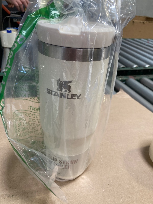 Photo 1 of STANLEY IceFlow Stainless Steel Tumbler with Straw - Vacuum Insulated Water Bottle for Home, Office or Car - Reusable Cup with Straw Leak Resistant Flip - Cold for 12 Hours or Iced for 2 Days (Cream)
