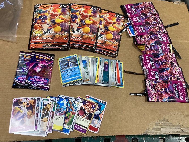 Photo 1 of LOT OF ASSORTED POKEMON/ONE PIECE CARDS/PACKS