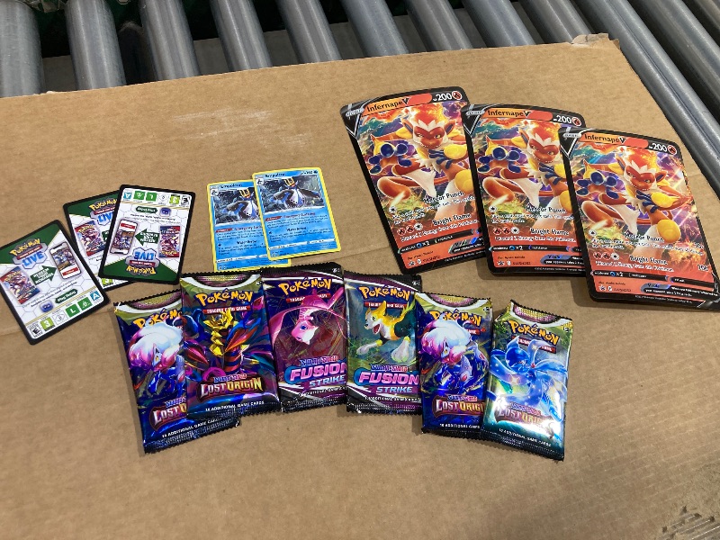 Photo 1 of LOT OF ASSORTED POKEMON CARDS/PACKS