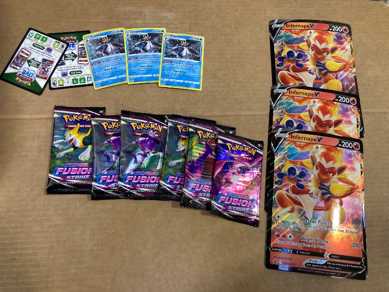 Photo 1 of LOT OF ASSORTED POKEMON CARDS/PACKS