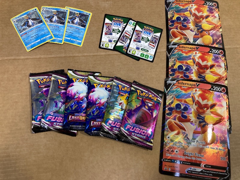 Photo 1 of LOT OF ASSORTED POKEMON CARDS/PACKS