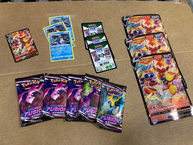 Photo 1 of LOT OF ASSORTED POKEMON CARDS/PACKS
