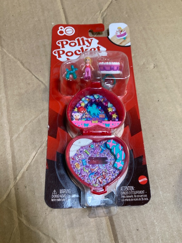 Photo 1 of Polly Pocket Mattel 80th Anniversary Compact Playset, Jewelry Box with Doll, Balloon Pet, and Wearable Ring, Ring Box with Celebration Theme