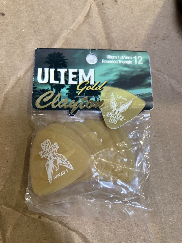 Photo 1 of Plectrum Ultem Gold, Rounded Triangle 1,07 mm, transparent gold, 12 pcs.