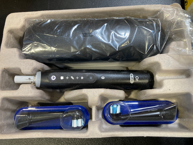 Photo 1 of Oral-B iO Deep Clean + Whiten Rechargeable Electric Toothbrush with Visible Pressure Sensor, 2 Minute Timer, 5 Cleaning Settings, 1 iO5 Limited, 3 Toothbrush Heads, Travel Case & Refill Holder, Black