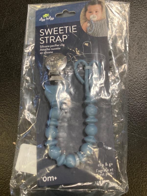 Photo 1 of Itzy Ritzy Silicone Pacifier Clip; 100% Food Grade Silicone Pacifier Strap with Clip Keeps Pacifiers, Teethers & Small Toys in Place Features One-Piece Design & Cord (Blue)
