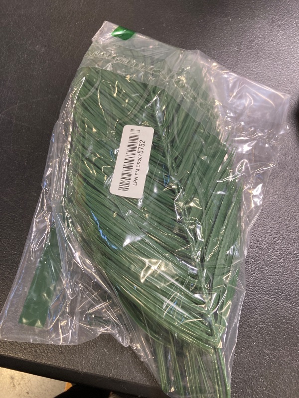 Photo 1 of CCINEE 16 PCS Artificial Palm Leaves, Faux Large Palm Fronds Fake Tropical Plant Simulation Safari Leaves with Stems for Home Hawaiian Luau Party Jungle Beach Theme Party Decoration