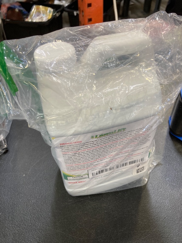 Photo 1 of Lawnlift Ultra Concentrated (Green) Grass Paint 64oz. Covers up to 2000 sq feet* Coverage Will Vary depending on Condition of Grass, Sprayer Setting, Dilution Ratio and Desired Shade.