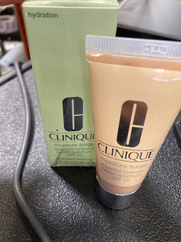 Photo 1 of Clinique Moisture Surge Sheertint Hydrator Hydrating Tinted Moisturizer Broad Spectrum SPF 25 With Hyaluronic Acid + Aloe Water For All Skin Types | Sheer Coverage, Natural Finish, Light, 1.4 Fl Oz