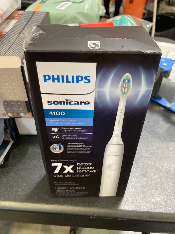 Photo 1 of Philips Sonicare 4100 Rechargeable Electric Toothbrush, with Pressure Sensor, 2 Intensity Settings, SmarTimer and QuadPacer, 14-Day Battery Life, White, Model HX3681/23