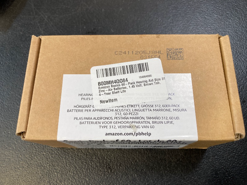 Photo 1 of Amazon Basics 60-Pack Hearing Aid Size 312 Zinc-Air Batteries, 1.45 Volt, Brown Tab, 4-Year Shelf Life, Child-Safe Package (Use Scissors to Open)