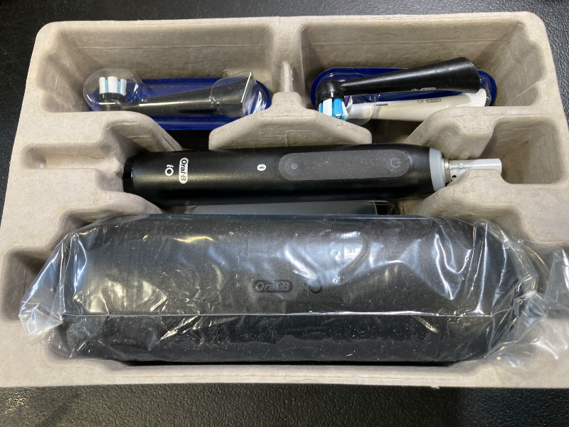 Photo 1 of Oral-B iO Deep Clean + Whiten Rechargeable Electric Toothbrush with Visible Pressure Sensor, 2 Minute Timer, 5 Cleaning Settings, 1 iO5 Limited, 3 Toothbrush Heads, Travel Case & Refill Holder, Black