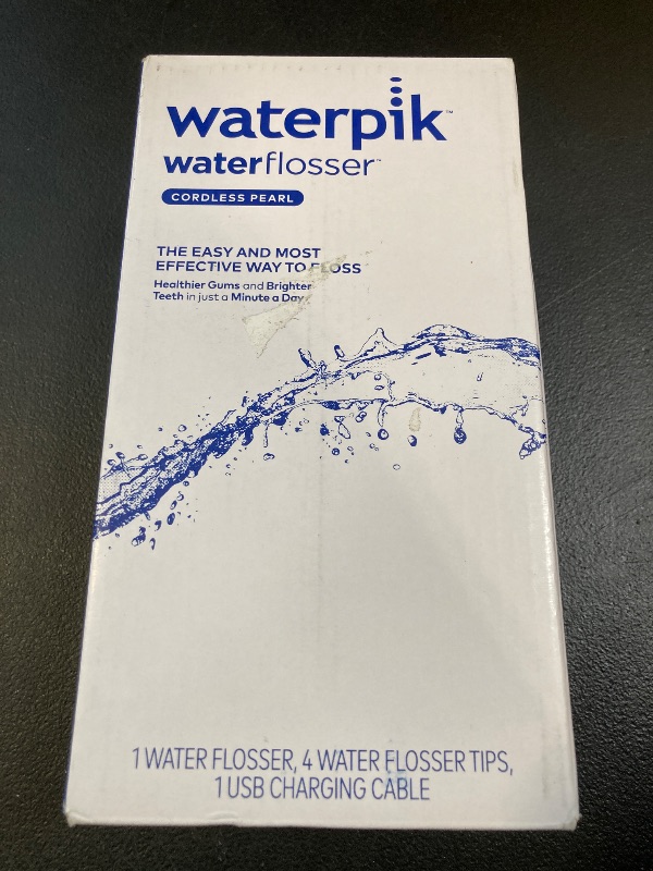 Photo 1 of Waterpik Cordless Pearl Rechargeable Portable Water Flosser for Teeth, Gums, Braces Care and Travel with 4 Flossing Tips - ADA Accepted, WF-13 White, Packaging May Vary