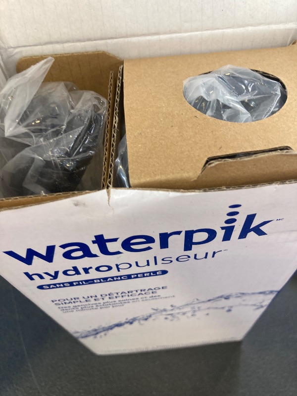 Photo 1 of Waterpik Cordless Pearl Rechargeable Portable Water Flosser for Teeth, Gums, Braces Care and Travel with 4 Flossing Tips - ADA Accepted, WF-13 Black, Packaging May Vary