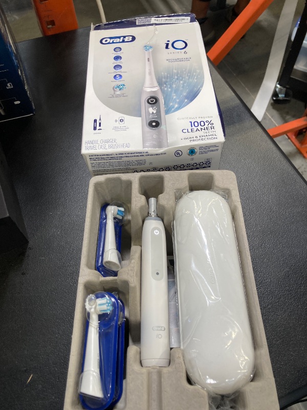 Photo 1 of Oral-B iO Series 6 Rechargeable Electric Toothbrush with Visible Pressure Sensor to Protect Gums, 2 Minute Timer, 5 Cleaning Settings, 1 Replacement Toothbrush Head, and Travel Case, Grey Opal