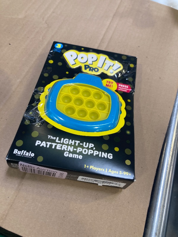 Photo 1 of Pop It! Pro - The Original Light Up, Pattern Popping, Pop It! Game from Buffalo Games,Blue and Yellow