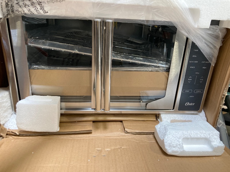 Photo 1 of Oster Air Fryer Oven 10-in-1 Countertop Toaster Large Enough for 2 Pizzas Stainless Steel French Doors XL Sized
