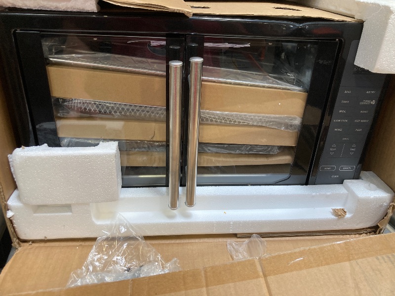 Photo 1 of Oster Air Fryer Oven, 10-in-1 Countertop Toaster Oven Stainless Steel French Doors
