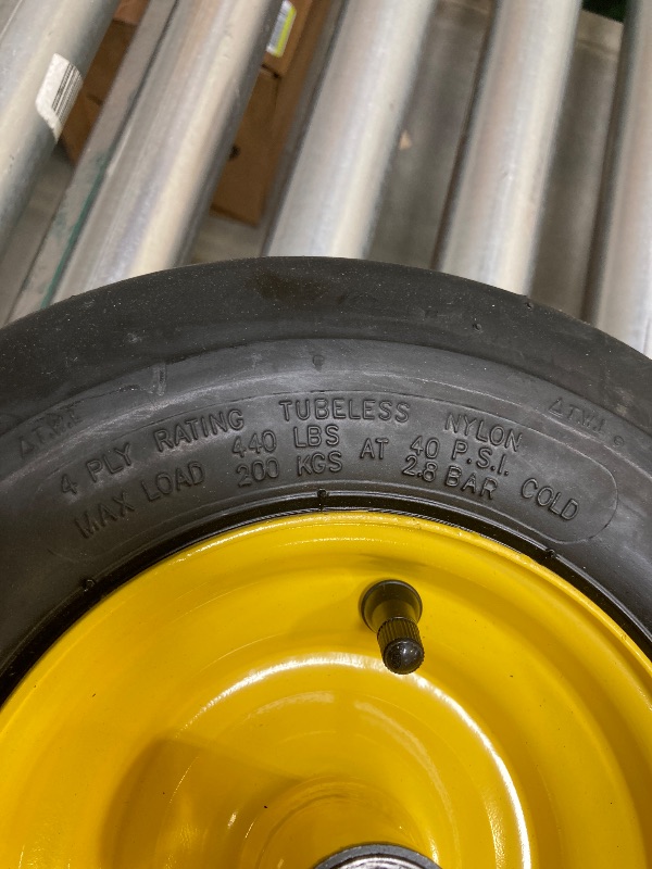 Photo 1 of 13x5.00-6 tubeless tire with yellow rim