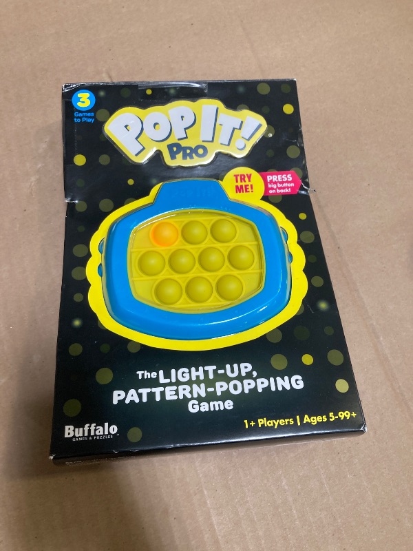 Photo 1 of Pop It! Pro - The Original Light Up, Pattern Popping, Pop It! Game from Buffalo Games,Blue and Yellow