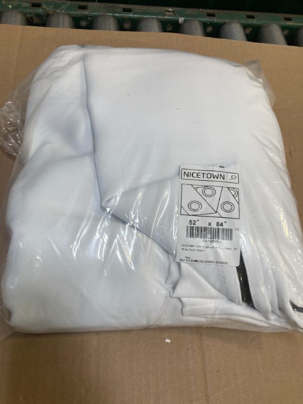 Photo 1 of NICETOWN 100% Blackout Window Curtain Panels, Cold and Full Light Blocking Drapes with Black Liner for Nursery, 84 inches Drop Thermal Insulated Draperies (White, 2 Pieces, 52 Wide Each Panel)