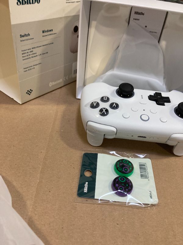 Photo 1 of 8Bitdo Ultimate 2 Bluetooth Controller with TMR Joysticks, Switchable Hall Effect/Tactile Triggers, Vibration, Motion Control, RGB Fire Ring and Back Buttons for Switch/Switch 2 & Windows PC - White