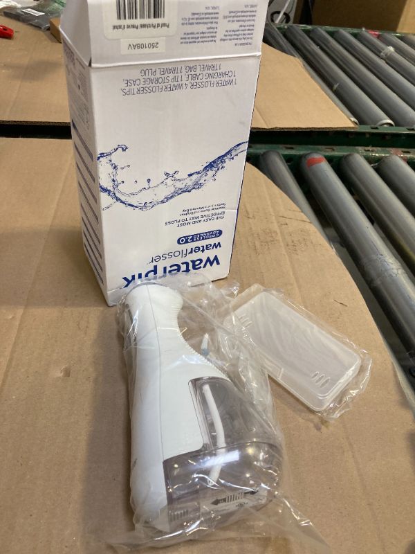 Photo 1 of Waterpik Cordless Advanced 2.0 Water Flosser For Teeth, Gums, Braces, Dental Care With Travel Bag and 4 Tips, ADA Accepted, Rechargeable, Portable, and Waterproof, White WP-580, Packaging May Vary