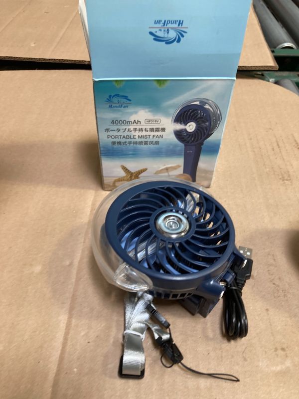 Photo 1 of HandFan 4000mAh Upgraded Handheld Misting Fan, 50ml Water Tank, Rechargeable Personal Mister Fan Portable AC, Spray Water Mist Fans, Foldable Cooling Ice Fans for Beach Travel Disney(Royal Blue)