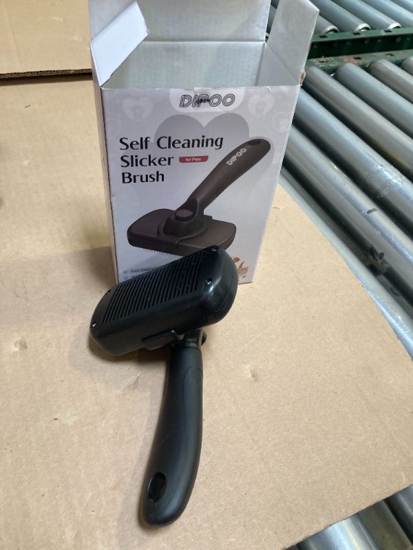 Photo 1 of Dipoo Self Cleaning Shedding Brush - Skin Friendly Grooming Tool for Dogs, Cats, and Puppies, Deshedding and Hair Removal for Long and Short Haired Pets, Black
