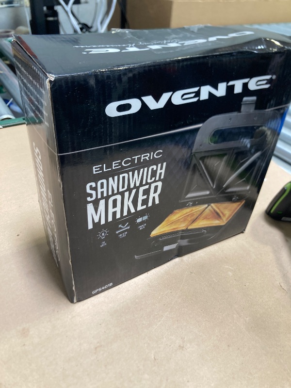 Photo 1 of OVENTE Electric Sandwich Maker with Non-Stick Plates, Indicator Lights, Cool Touch Handle, Easy to Clean and Store, Perfect for Cooking Breakfast, Grilled Cheese, Tuna Melts and Snacks, Black GPS401B