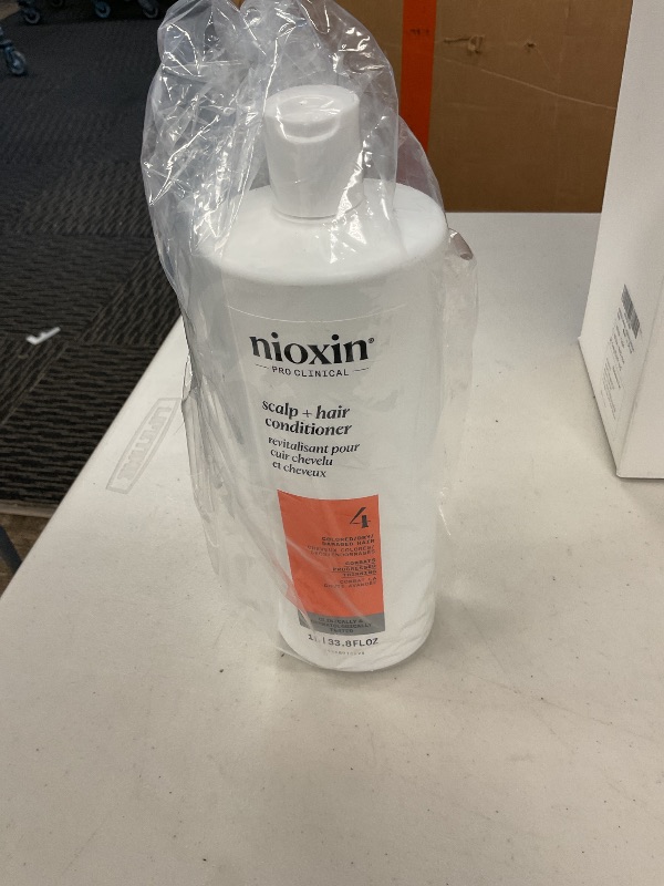 Photo 1 of Nioxin System 4 Scalp + Hair Conditioner | For Colored or Damaged Hair with Progressed Thinning | With Niacinamide and Biotin | 33.8 Fl oz.
