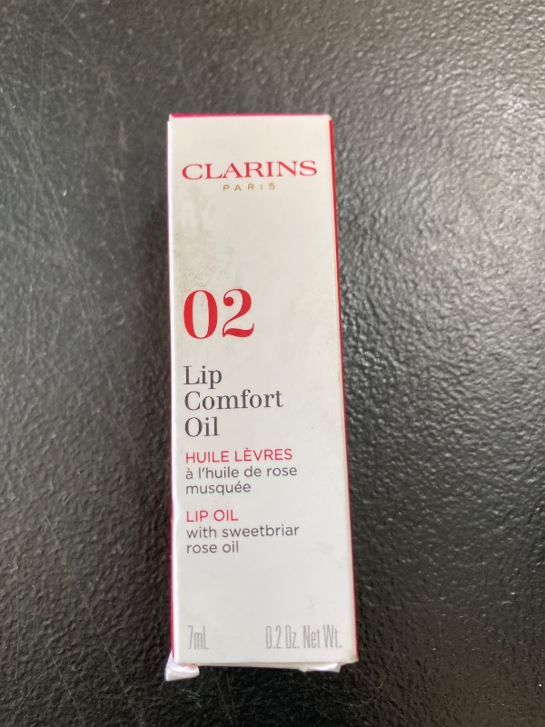 Photo 1 of Clarins Lip Comfort Oil - Soothes, Hydrates and Plumps Lips with 93% Natural Ingredients